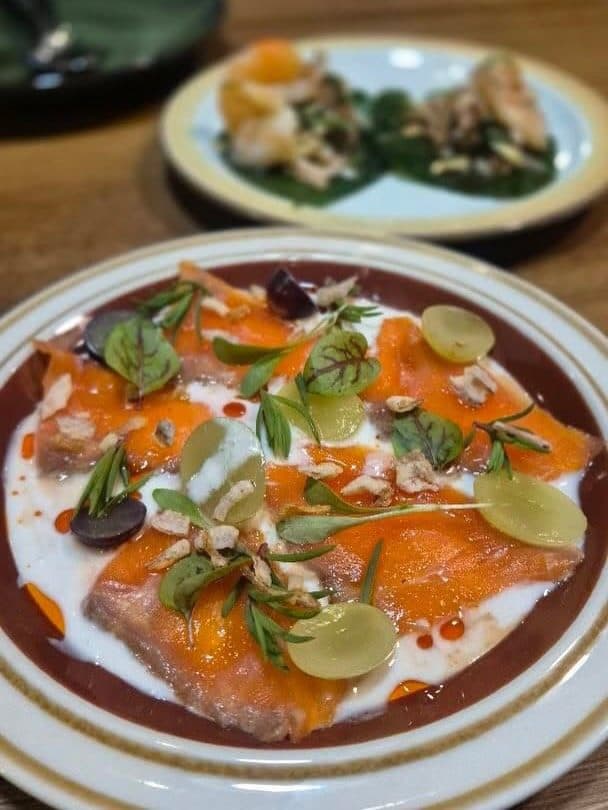 A plated Thai salmon dish at Rice Club
